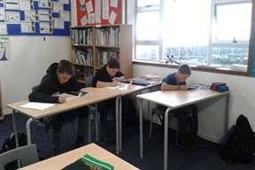 Students sitting at desks in school